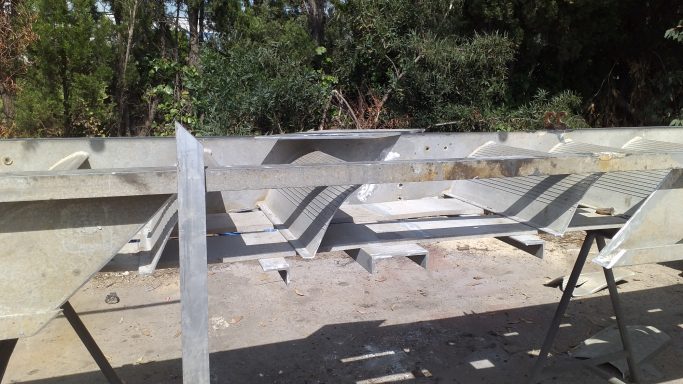 Aluminium gangway frame refurbishment including replacement of damaged sections and surface preparation.