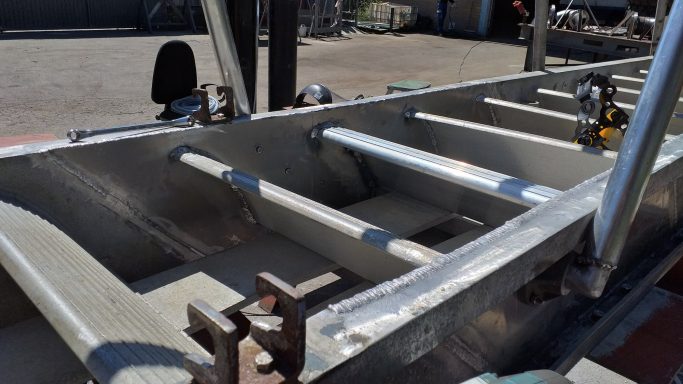 Detail of aluminium profiles and structural elements prepared for welding and final assembly.