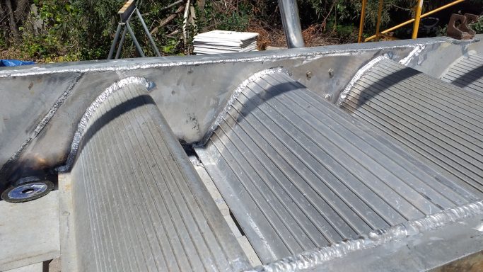 Close-up of aluminium tread plates and anti-slip surfaces renewed during gangway refurbishment.

