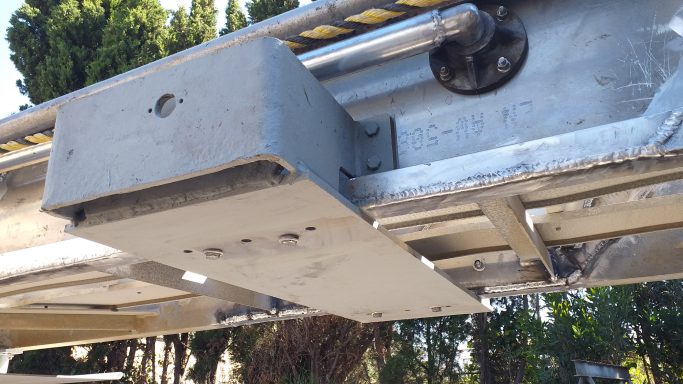 Aluminium structural assembly inspected and prepared for final installation and load verification.